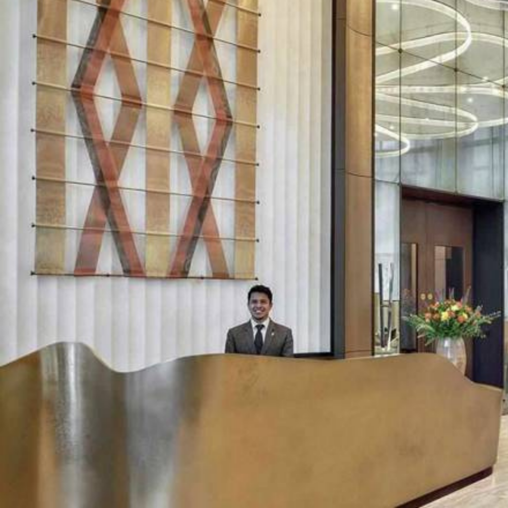 Bronze liquid metal, bronze reception desk, bronze curves